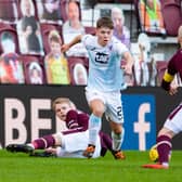 Rangers youngster Kai Kennedy takes on Hearts captain Steven Naismith during his impressive debut for loan side Raith Rovers  (Photo by Paul Devlin / SNS Group)