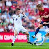 Scotland midfielders Callum McGregor and Scott McTominay challange Norway's Martin Odegaard. (Photo by FREDRIK VARFJELL/NTB/AFP via Getty Images)