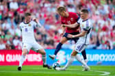 Scotland midfielders Callum McGregor and Scott McTominay challange Norway's Martin Odegaard. (Photo by FREDRIK VARFJELL/NTB/AFP via Getty Images)