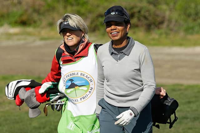 Kathryn Imrie caddying for former US Secretary of State Condoleezza Rice during the 2013 AT&T Pebble Beach National Pro-Am at the Monterey Peninsula Country Club in California. Picture: Ezra Shaw/Getty Images.