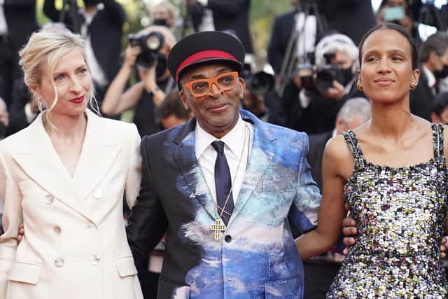 Jury president Spike Lee, center, poses with jury members Jessica Hausner, left, and Mati Diop upon arrival at the awards ceremony and premiere of the closing film 'OSS 117: From Africa with Love' at the 74th international film festival in Cannes. (AP Photo/Brynn Anderson)