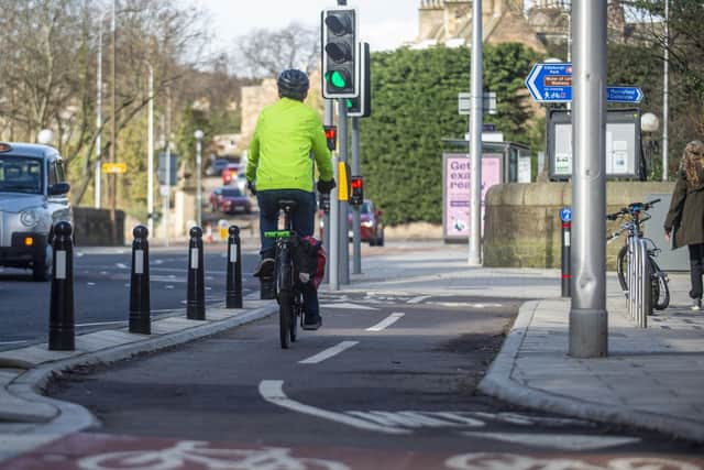 The west end of the route in Roseburn showing bollards protecting the cycle lane from other vehicles. (Photo by Lisa Ferguson/The Scotsman)