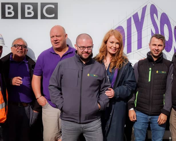 Liam Richards (third from left) and Michael Cummins (second from right) with the DIY SOS team