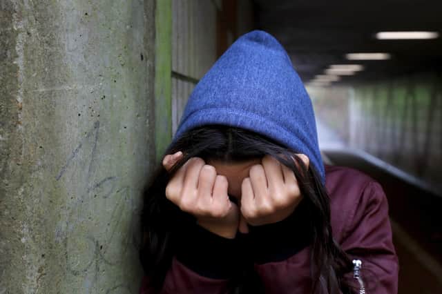 A teenage girl with her head in her hands showing signs of mental health issues. Picture: Gareth Fuller/PA Wire