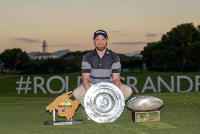 Nathan Kimsey celebrates with the trophies after winning the Challenge Tour's Rolex Grand Final suported by The R&A at Club de Golf Alcanada and also topping the Road to Mallorca Rankings. Picture: Octavio Passos/Getty Images.