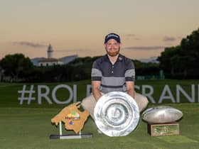 Nathan Kimsey celebrates with the trophies after winning the Challenge Tour's Rolex Grand Final suported by The R&A at Club de Golf Alcanada and also topping the Road to Mallorca Rankings. Picture: Octavio Passos/Getty Images.