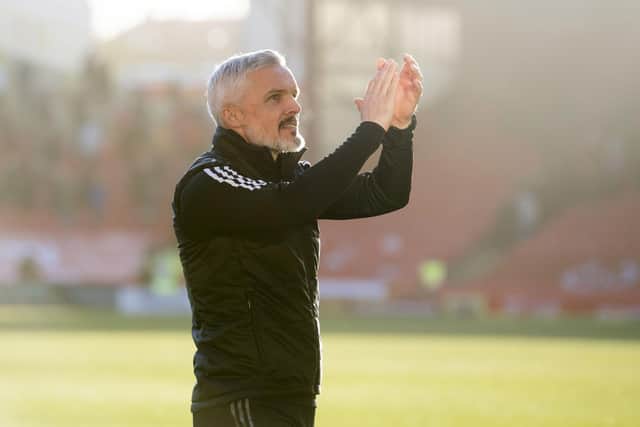 Jim Goodwin salutes the Aberdeen fans after the 3-1 win over Hibs.
