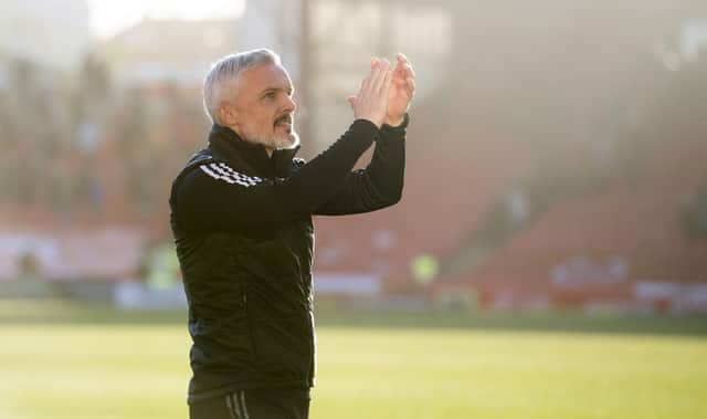 Jim Goodwin salutes the Aberdeen fans after the 3-1 win over Hibs.