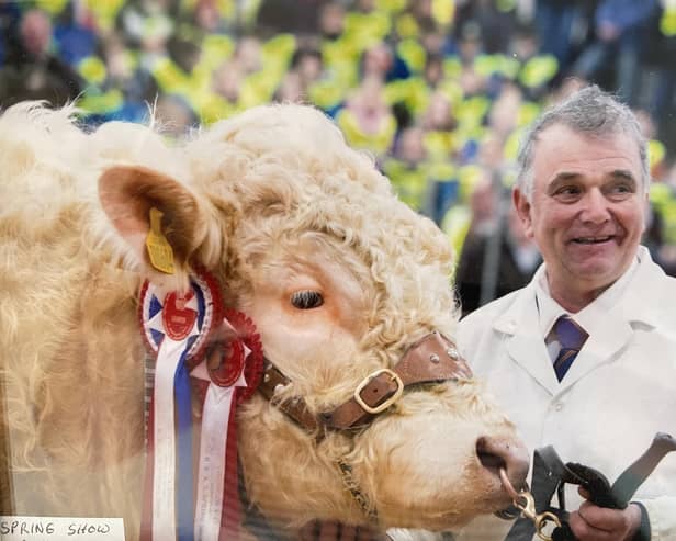 Ian Matthew with the champion Charolais bull at the Royal Northern Spring Show in 2014