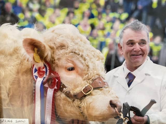 Ian Matthew with the champion Charolais bull at the Royal Northern Spring Show in 2014