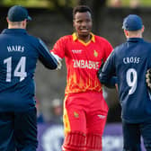 Players of both teams shake hands after the end of the series during a T20 international between Scotland and Zimbabwe at the Grange.