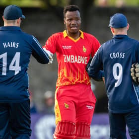 Players of both teams shake hands after the end of the series during a T20 international between Scotland and Zimbabwe at the Grange.