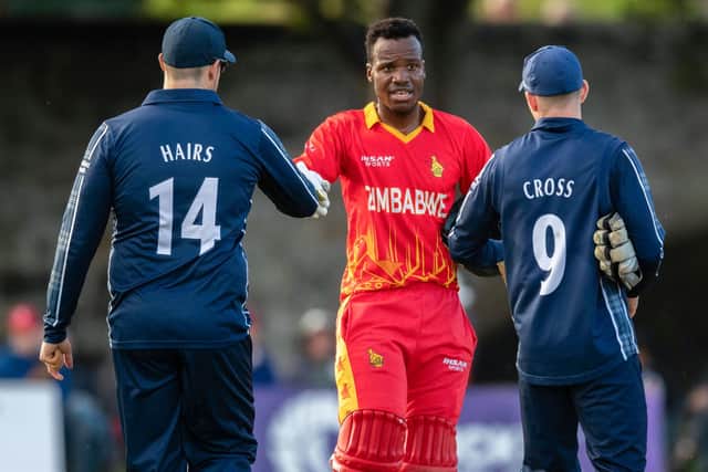 Players of both teams shake hands after the end of the series during a T20 international between Scotland and Zimbabwe at the Grange.