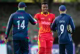 Players of both teams shake hands after the end of the series during a T20 international between Scotland and Zimbabwe at the Grange.