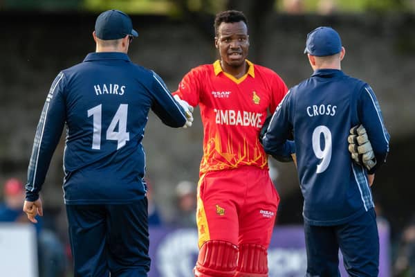 Players of both teams shake hands after the end of the series during a T20 international between Scotland and Zimbabwe at the Grange.