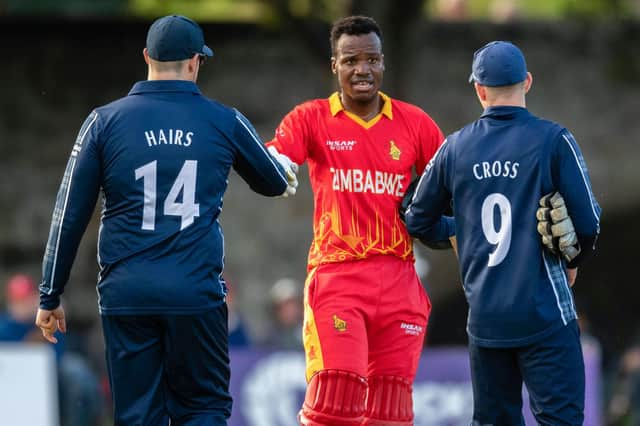 Players of both teams shake hands after the end of the series during a T20 international between Scotland and Zimbabwe at the Grange.