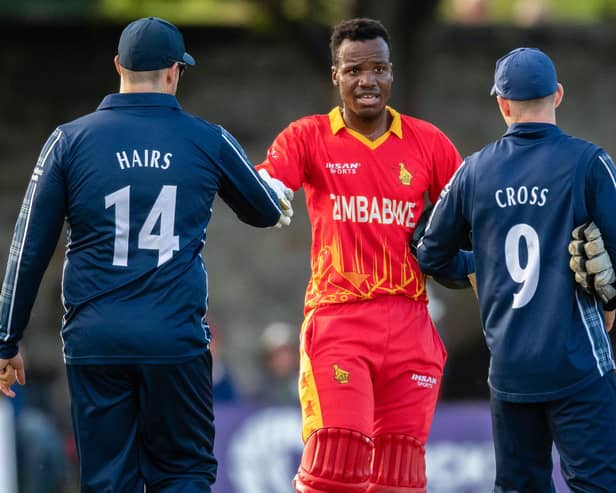 Players of both teams shake hands after the end of the series during a T20 international between Scotland and Zimbabwe at the Grange.