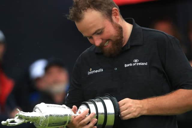 Shane Lowry of Ireland poses with the claret jug open trophy after winning the 148th Open Championship held on the Dunluce Links at Royal Portrush Golf Club on July 21, 2019 in Portrush, United Kingdom. (Photo by Andrew Redington/Getty Images)