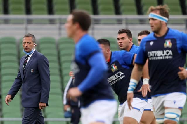 Franco Smith (L) watches his Italy players warm up ahead of a Six Nations match in Ireland in 2020. (Photo by BRIAN LAWLESS/POOL/AFP via Getty Images)