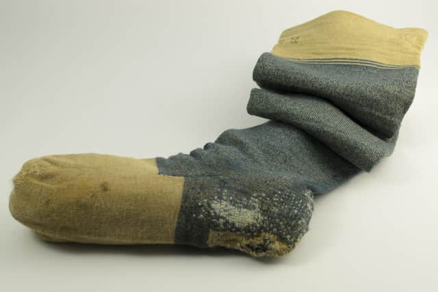 This hand-knitted woollen sock, carrying the initials RB, is one of the popular and "quirky" items on show in the exhibition
