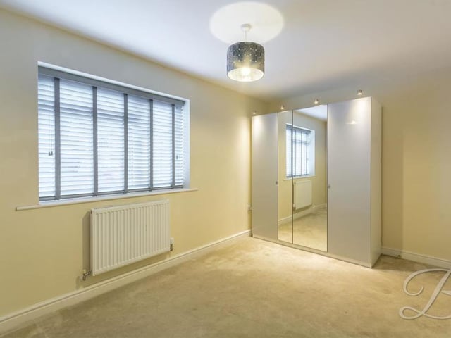 The second bedroom is also a fine size. It features a carpeted floor, a central heating radiator and a window overlooking the front of the bungalow.