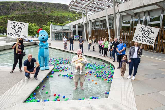 Martin Hannah (centre, in the water) and Sarah Davidson (far right) have been among soft play bosses protesting at the Scottish Parliament. Picture: Lisa Ferguson.
