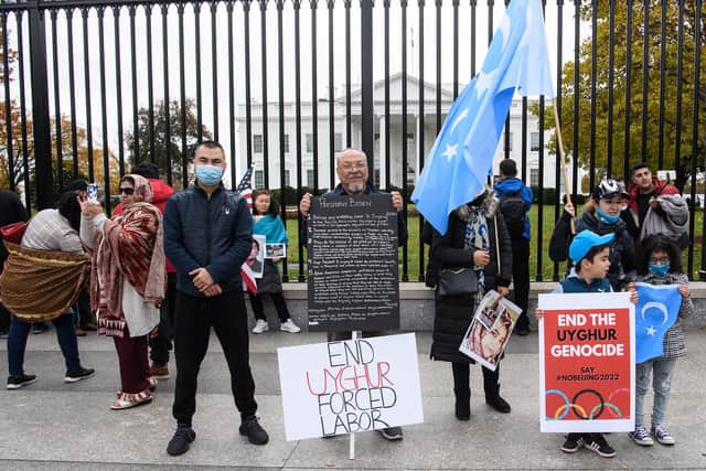 Uyghur, Tibetan, Hong Kong and Taiwanese people protest in front of the White House in Washington, DC, last month (Picture: Nicholas Kamm/AFP via Getty Images)