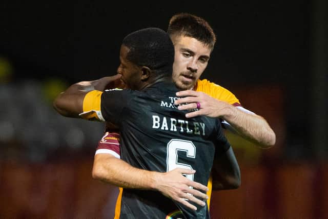 Motherwell's Declan Gallagher and Livingston's Marvin Bartley at full-time.