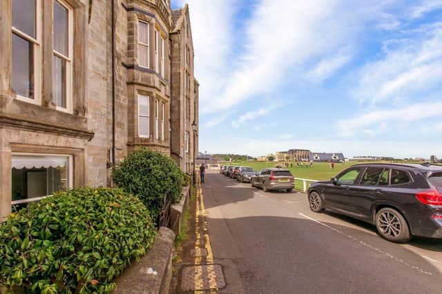 The front door of the flat is on a road that runs right next to the St Andrews Old Course.
