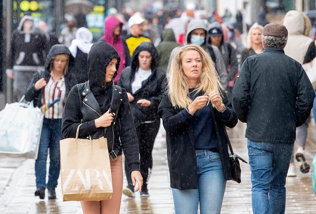Pedestrians on Edinburgh's Princes Street. (Photo by LESLEY MARTIN/AFP via Getty Images)