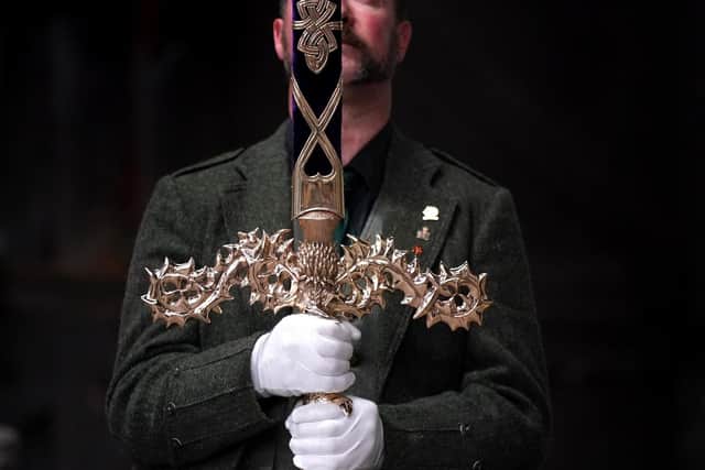 Paul Macdonald, custom sword and knife maker holds the Elizabeth sword which will form part of the Honours of Scotland to be presented to King Charles III along with the crown and sceptre during the Service of Thanksgiving at St Giles Cathedral in Edinburgh. PIC:  Andrew Milligan/PA Wire