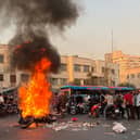 The biggest wave of social unrest in Iran in almost three years has seen protesters chant 'Woman, Life, Freedom' and 'down with the dictator' (Picture: AFP via Getty Images)