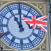 The clock face of Elizabeth Tower, known after the bell Big Ben, shows the hands at 11 o'clock as a Union Flag flies in front of it in London. Picture Justin Tallis/AFP via Getty Images