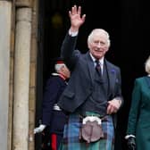 King Charles III and the Queen Consort wave as they leave Dunfermline Abbey, after a visit to mark its 950th anniversary, and after attending a meeting at the City Chambers in Dunfermline, Fife, where the King formally marked the conferral of city status on the former town.