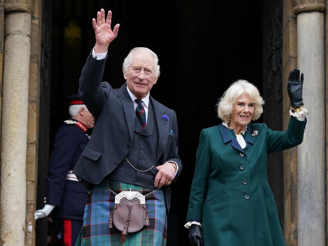 King Charles III and the Queen Consort wave as they leave Dunfermline Abbey, after a visit to mark its 950th anniversary, and after attending a meeting at the City Chambers in Dunfermline, Fife, where the King formally marked the conferral of city status on the former town.