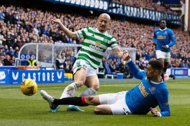 GLASGOW, SCOTLAND - APRIL 03: Celtic's Daizen Maeda (L) competes with Rangers' Leon Balogun during a cinch Premiership match between Rangers and Celtic at Ibrox Stadium, on April 02, 2022, in Glasgow, Scotland.  (Photo by Craig Williamson / SNS Group)