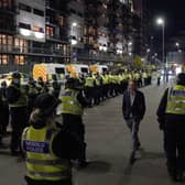 Welsh Police officers with colleagues from around the UK wait for protesters at the entrance of the Scottish Event Campus in Glasgow. Picture: Andrew Milligan/PA Wire