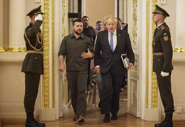 Ukrainian President Volodymyr Zelenskyy and Prime Minister Boris Johnson, walk after their meeting in Kyiv, Ukraine, last month.