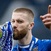 St Johnstone match-winner Shaun Rooney lifts with the Betfred Cup after his header was the difference in a 1-0 win over Livingston. (Photo by Craig Williamson / SNS Group)