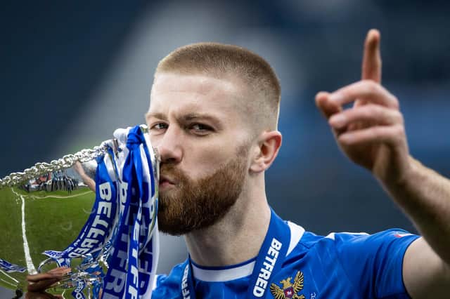 St Johnstone match-winner Shaun Rooney lifts with the Betfred Cup after his header was the difference in a 1-0 win over Livingston. (Photo by Craig Williamson / SNS Group)