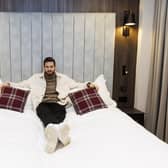 Hearts goalkeeper Craig Gordon gets comfy in one of the room's emperor beds.