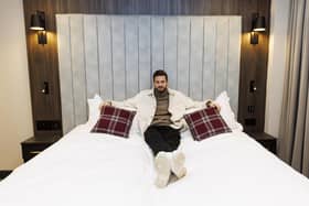 Hearts goalkeeper Craig Gordon gets comfy in one of the room's emperor beds.