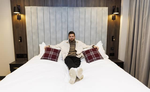 Hearts goalkeeper Craig Gordon gets comfy in one of the room's emperor beds.