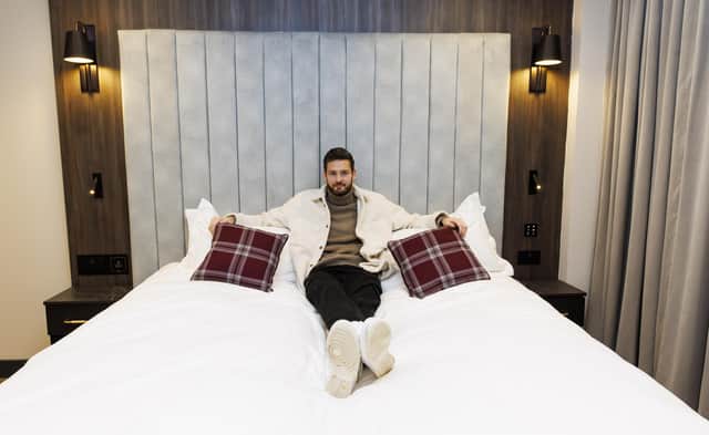 Hearts goalkeeper Craig Gordon gets comfy in one of the room's emperor beds.