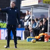 Dundee assistant Simon Rusk gives instructions.