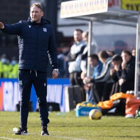 Dundee assistant Simon Rusk gives instructions.