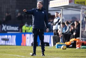 Dundee assistant Simon Rusk gives instructions.