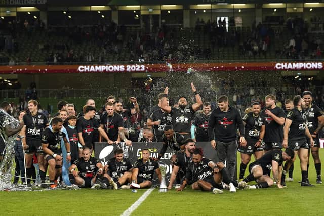 The Toulon players celebrate with the Challenge Cup after their success in Dublin.