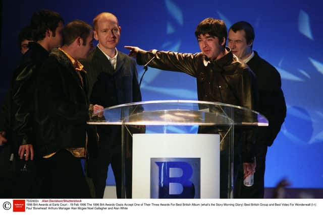 McGee with Oasis The 1996 Brit Awards as they accept One of Their Three Awards For Best British Album (what's the Story Morning Glory) Best British Group and Best Video For Wonderwall (l-r): Paul 'Bonehead' Arthurs Manager Alan McGee Noel Gallagher and Alan White.