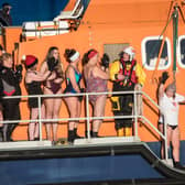 ​The intrepid swimmers get ready to take to the waters at Fraserbugh Harbour. Pic: RNLI